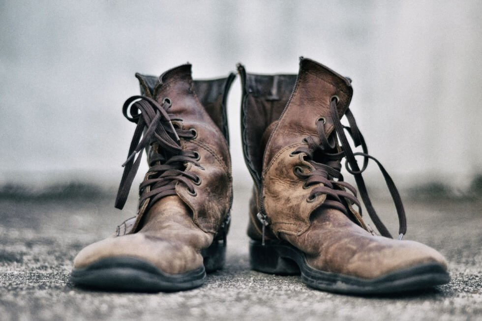 rugged boots on asphalt